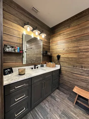 a bathroom with a sink and a mirror