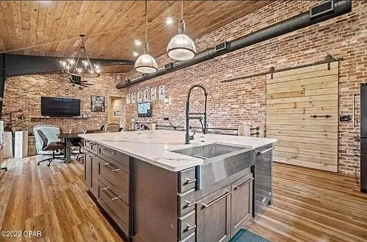 a kitchen with sink stove and cabinets