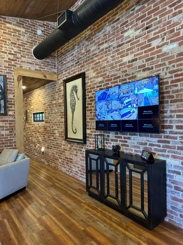 a open kitchen with granite countertop a stove and a wooden cabinets