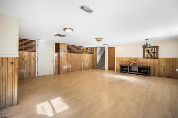 a view of a livingroom with a staircase