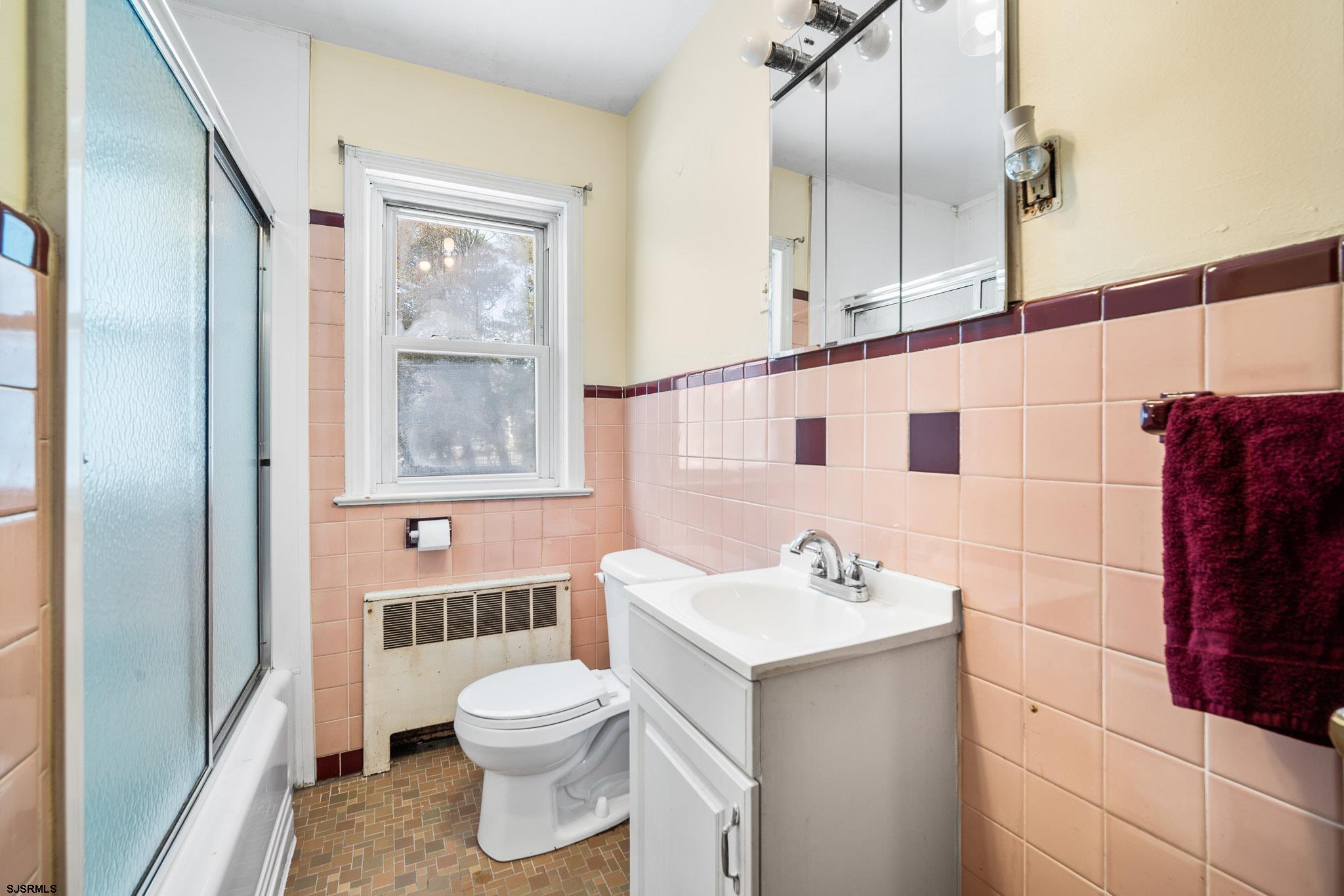 123 Bayview Drive Absecon, NJ 08201 - Photo 18 of 23 a bathroom with a sink a toilet and shower