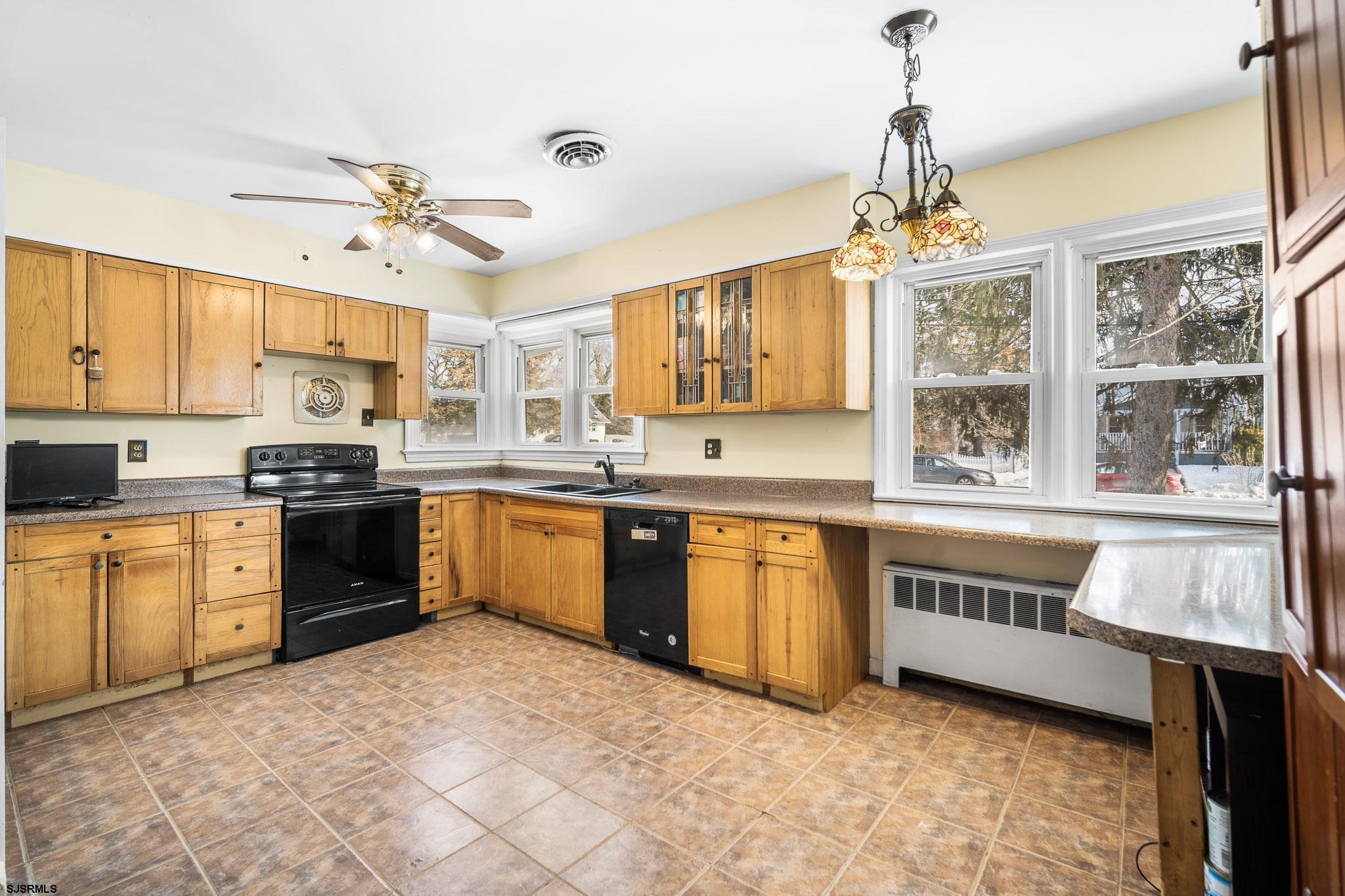123 Bayview Drive Absecon, NJ 08201 - Photo 6 of 23 a kitchen with stainless steel appliances granite countertop a stove sink and cabinets