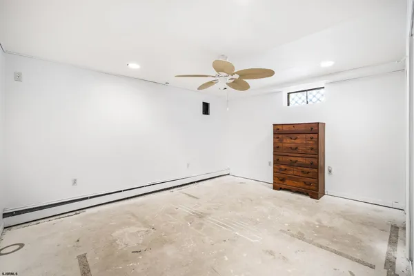 an empty room with closet and wooden floor