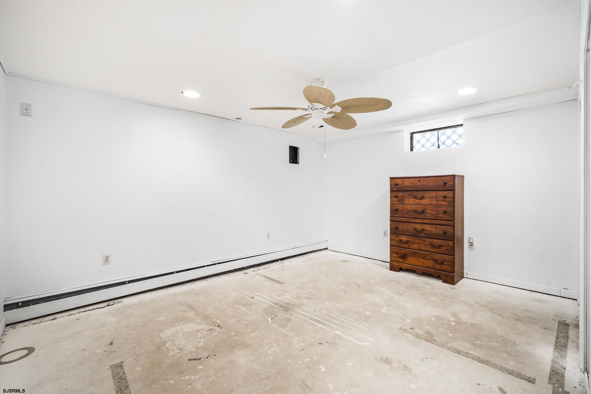 123 Bayview Drive Absecon, NJ 08201 - Photo 8 of 23 an empty room with closet and wooden floor