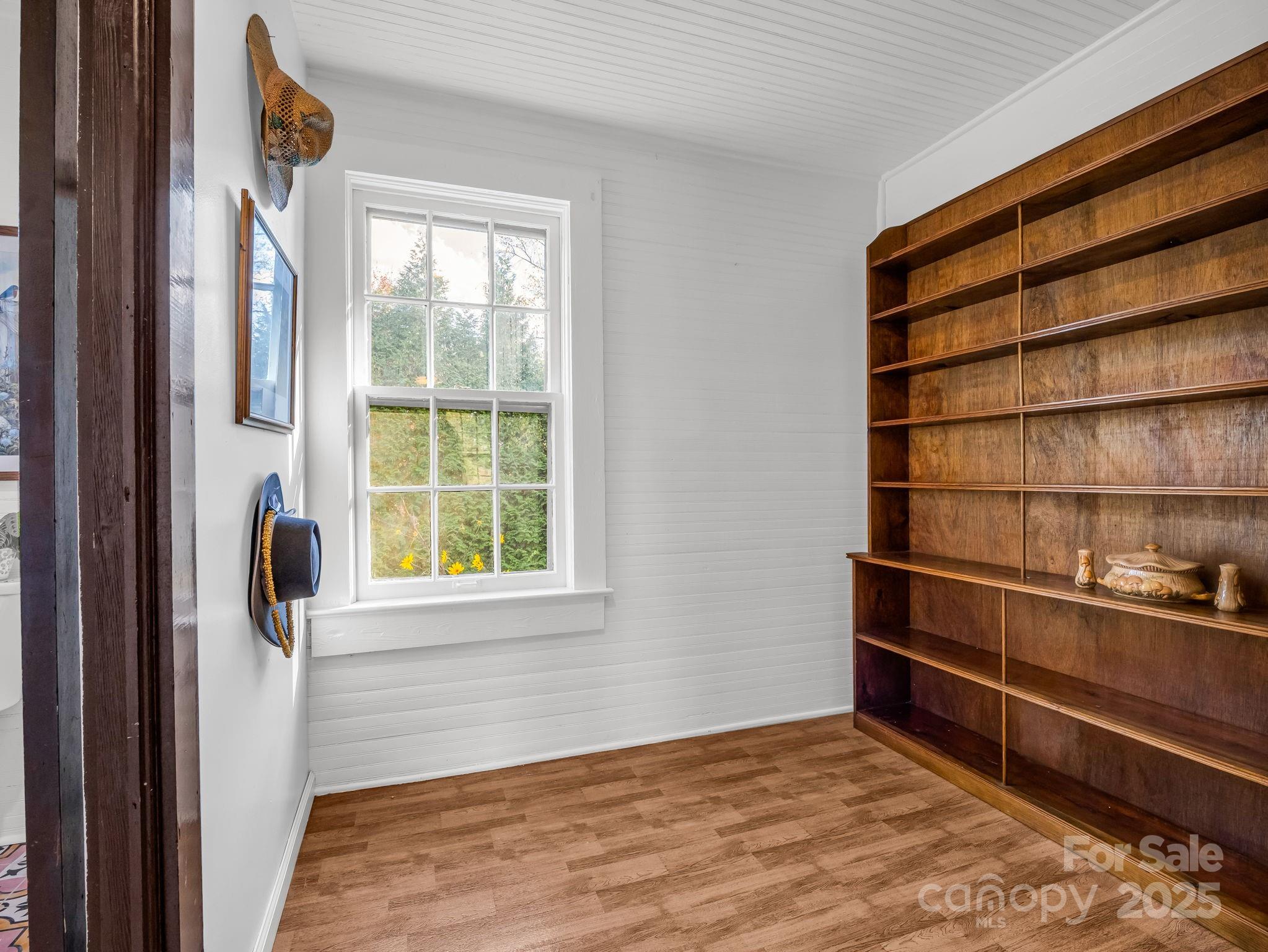 1600 Orchard Road Flat Rock, NC 28731 - Photo 11 of 33 a view of a room with wooden floor and windows