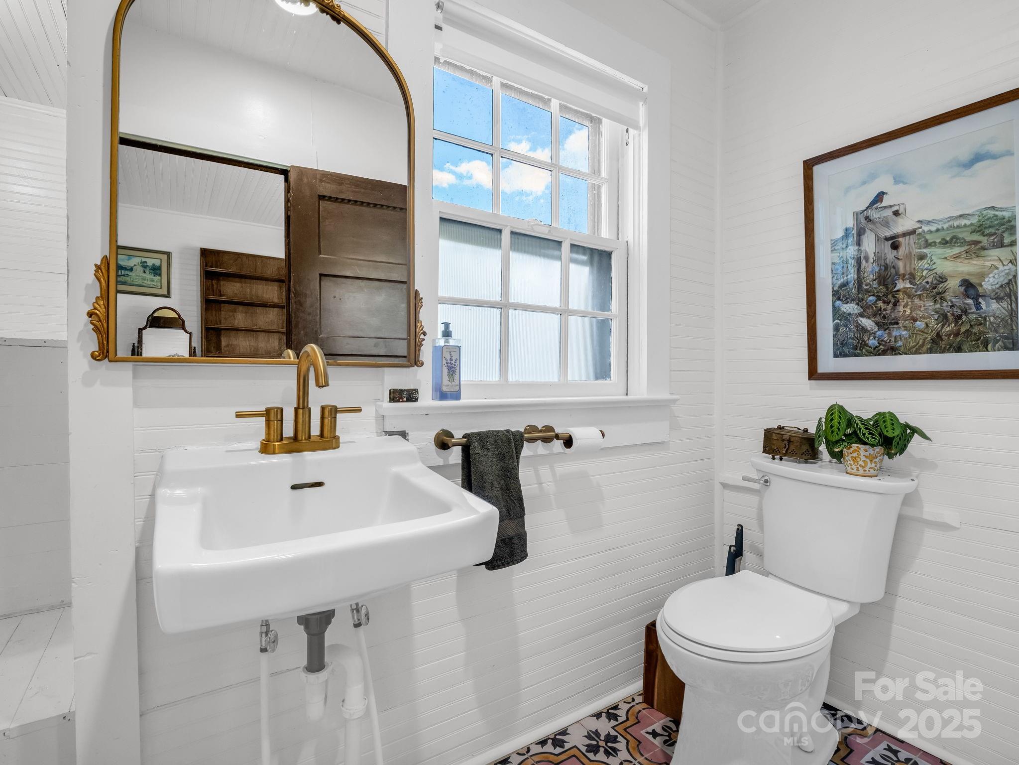 1600 Orchard Road Flat Rock, NC 28731 - Photo 13 of 33 a bathroom with a sink toilet and mirror
