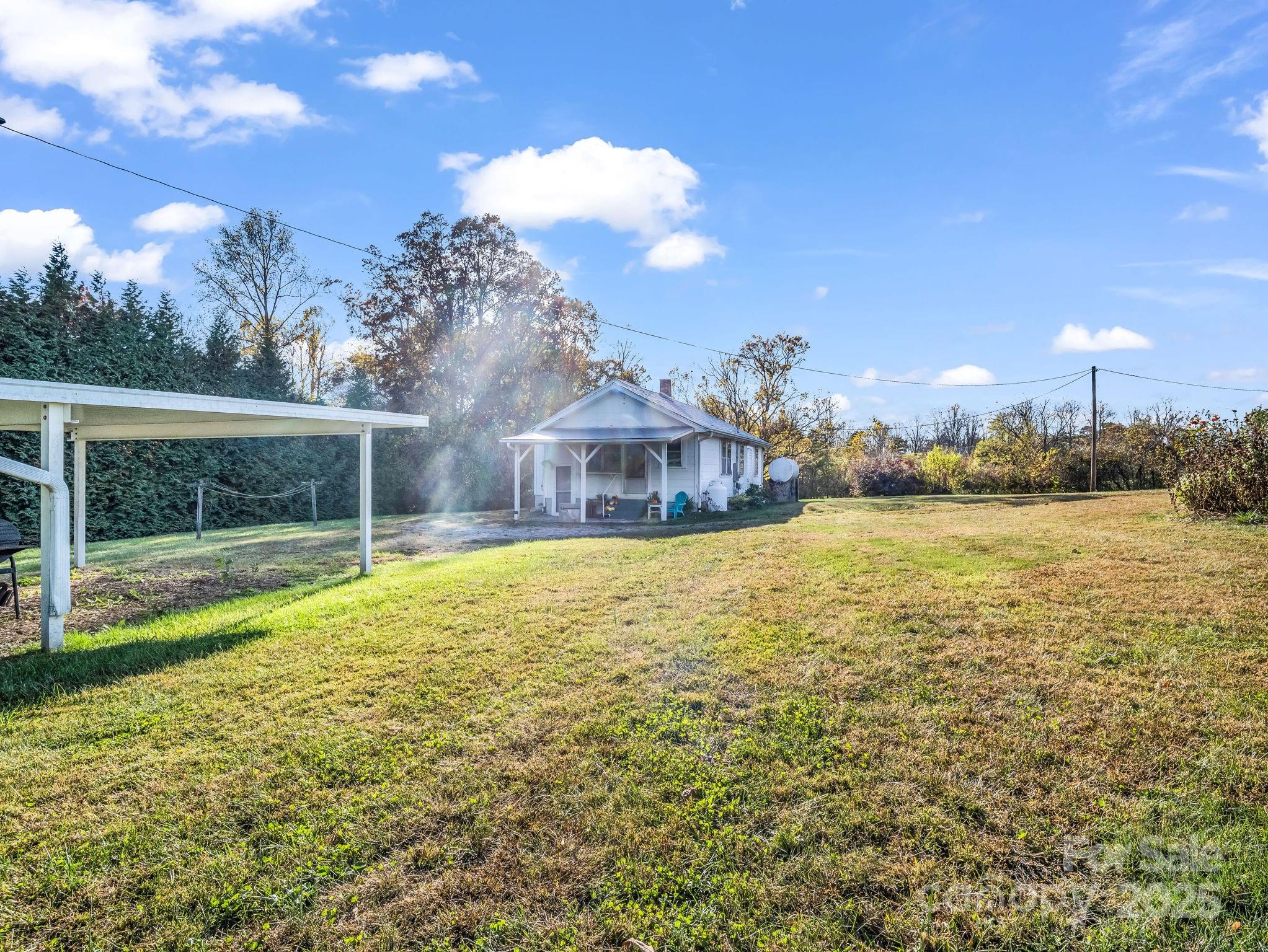 1600 Orchard Road Flat Rock, NC 28731 - Photo 27 of 33 a view of a house with a yard