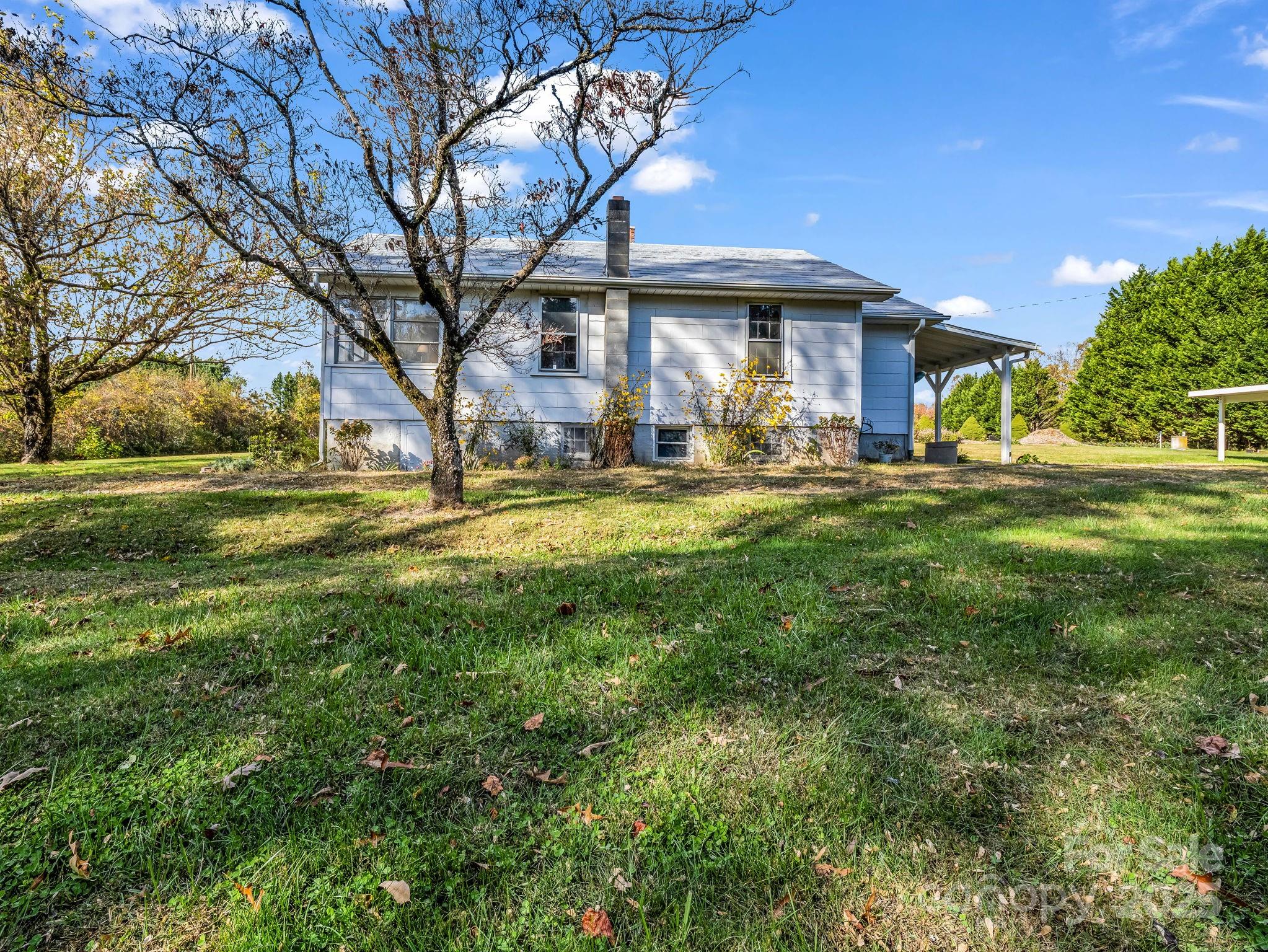 1600 Orchard Road Flat Rock, NC 28731 - Photo 28 of 33 a view of a house with a yard