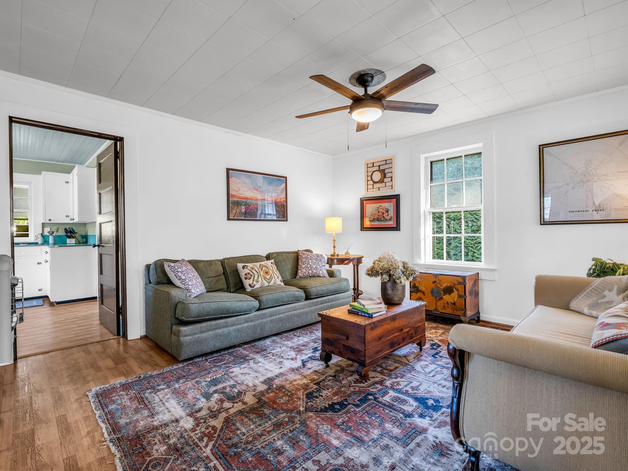 1600 Orchard Road Flat Rock, NC 28731 - Photo 5 of 33 a living room with furniture a rug and a large window