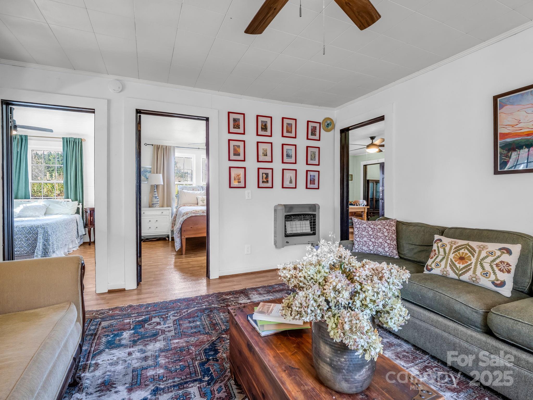 1600 Orchard Road Flat Rock, NC 28731 - Photo 6 of 33 a living room with furniture and wooden floor