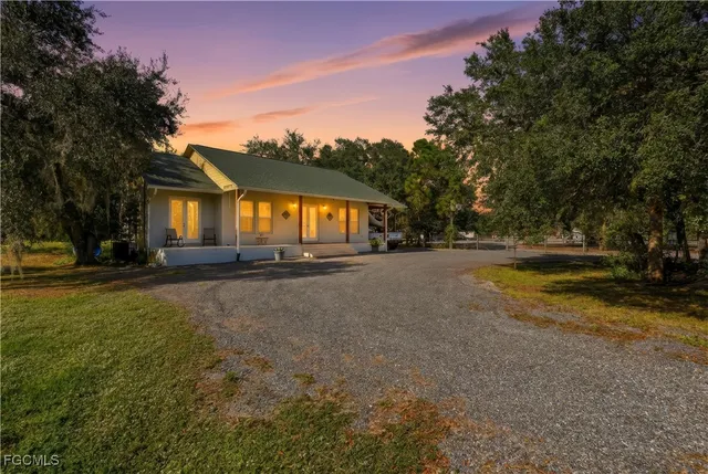 a view of swimming pool is middle in the garden