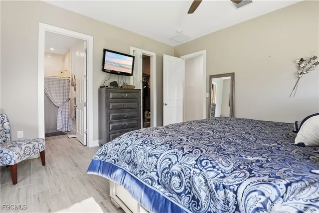 a bedroom with a bed and a dresser