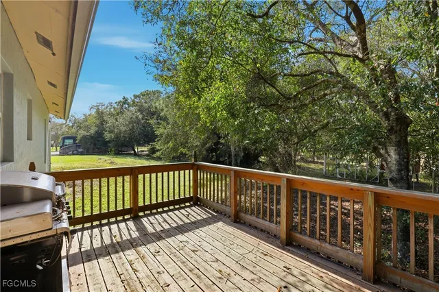 a view of balcony with wooden floor