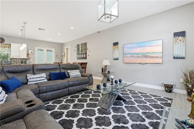 a living room with furniture and a rug