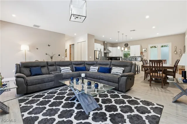 a living room with furniture and a rug