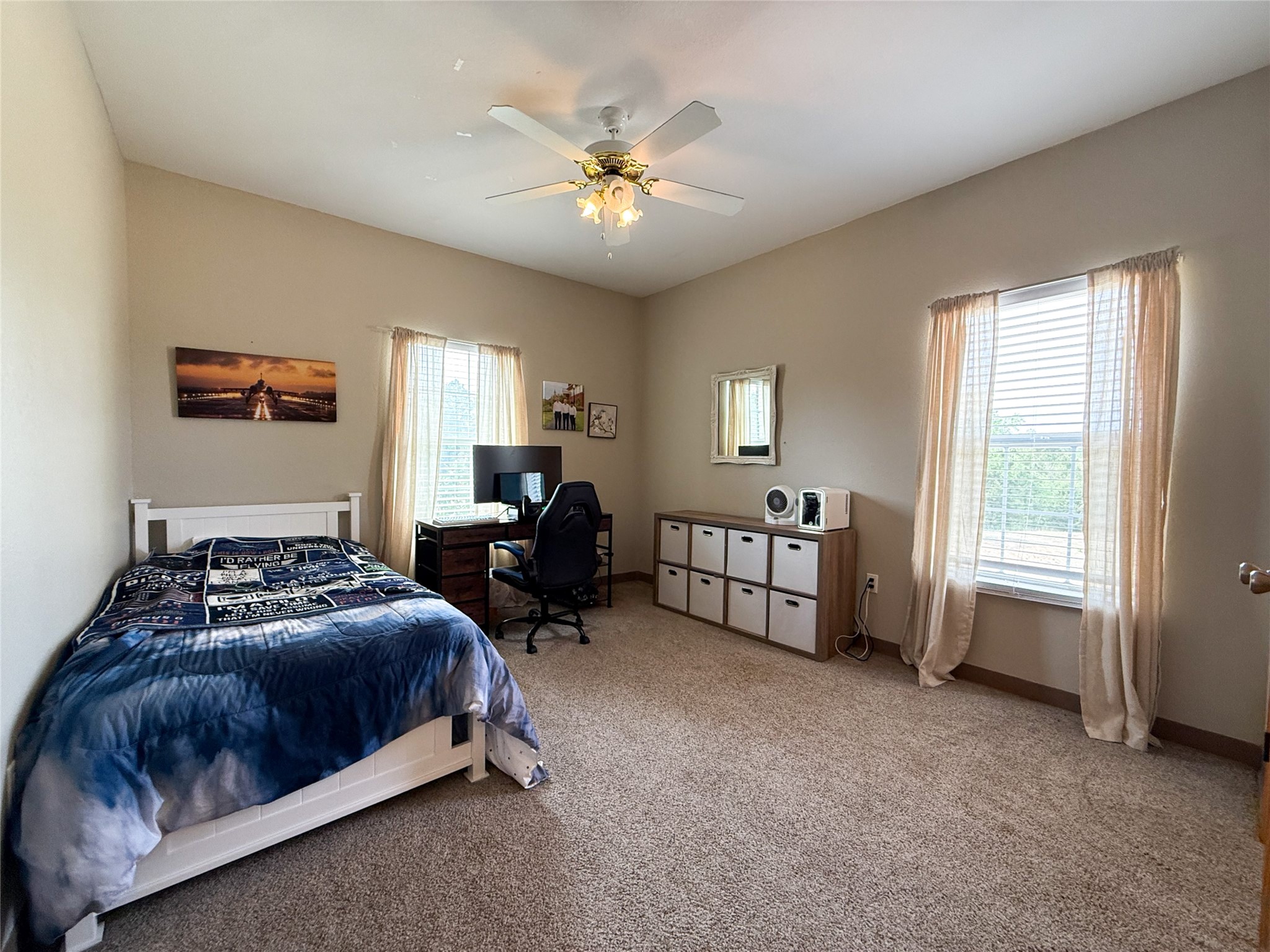 740 Bridget Avenue Buffalo, TX 75831 - Photo 35 of 50 a bedroom with a bed and a chandelier