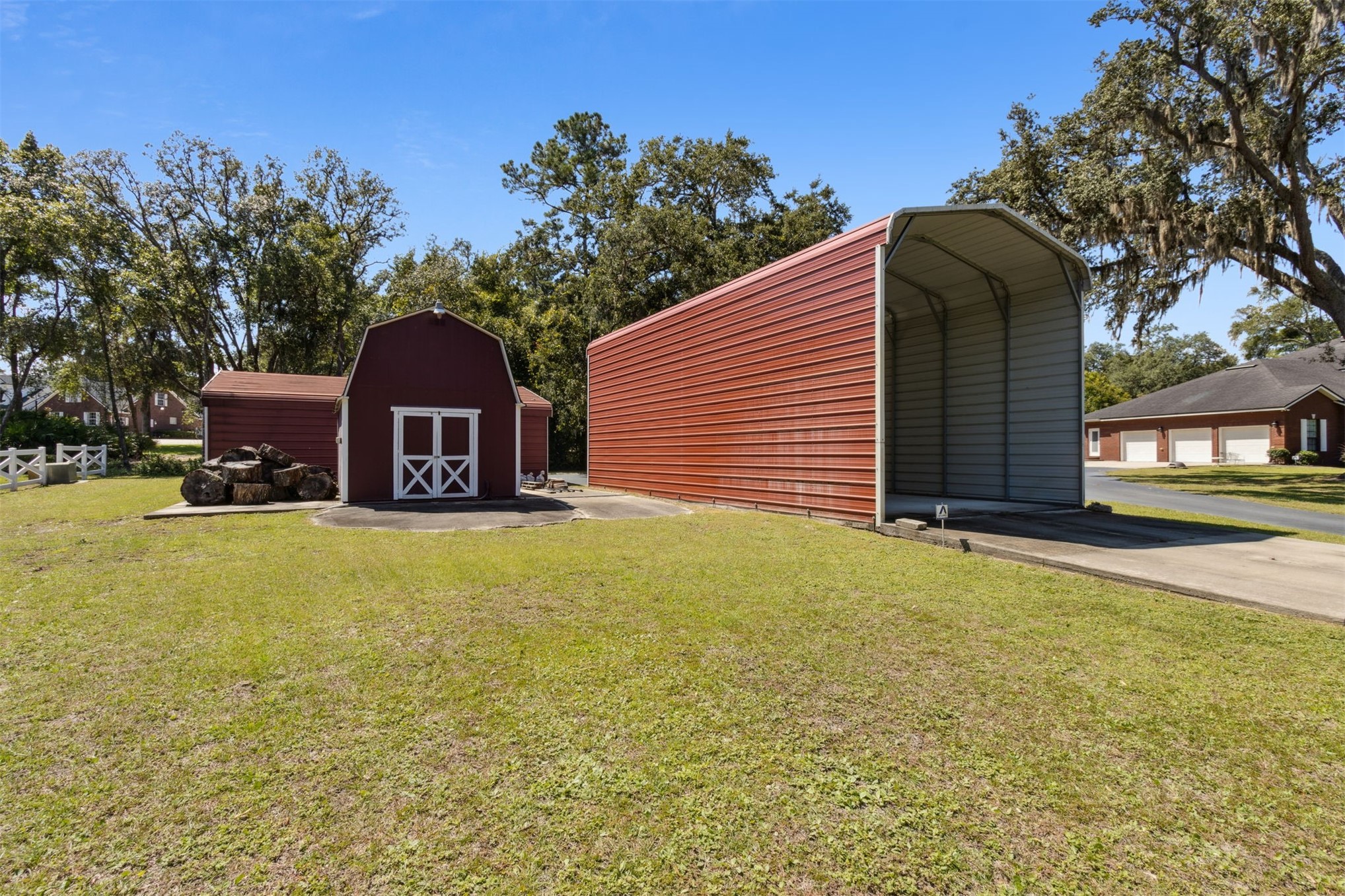87377 Raddin Road Yulee, FL 32097 - Photo 70 of 75 a front view of a house with yard and tree