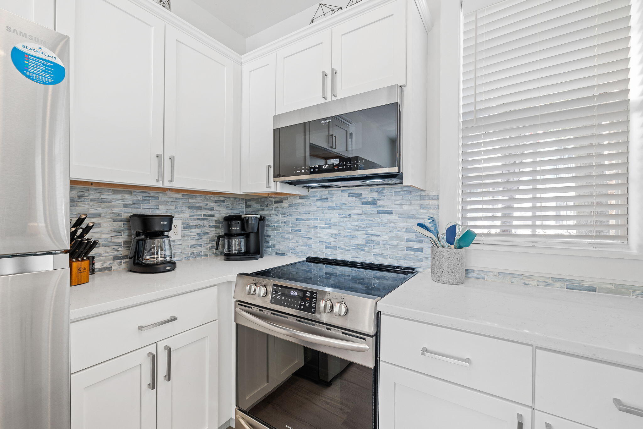 198 Somerset Bridge Road, Unit 137 Santa Rosa Beach, FL 32459 - Photo 12 of 46 a kitchen with a stove and cabinets