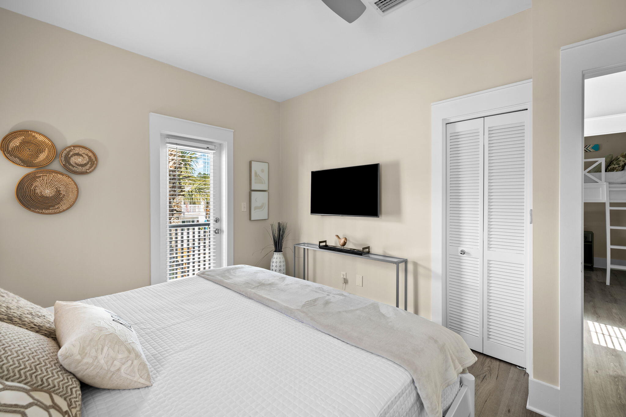 198 Somerset Bridge Road, Unit 137 Santa Rosa Beach, FL 32459 - Photo 21 of 46 a bedroom with a bed and a flat screen tv