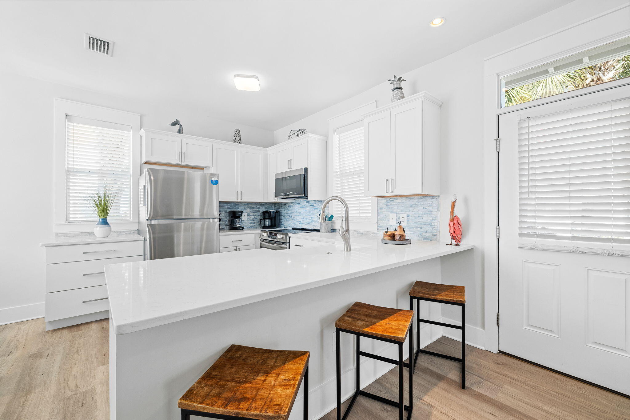 198 Somerset Bridge Road, Unit 137 Santa Rosa Beach, FL 32459 - Photo 3 of 46 a kitchen with stainless steel appliances a refrigerator and a stove top oven