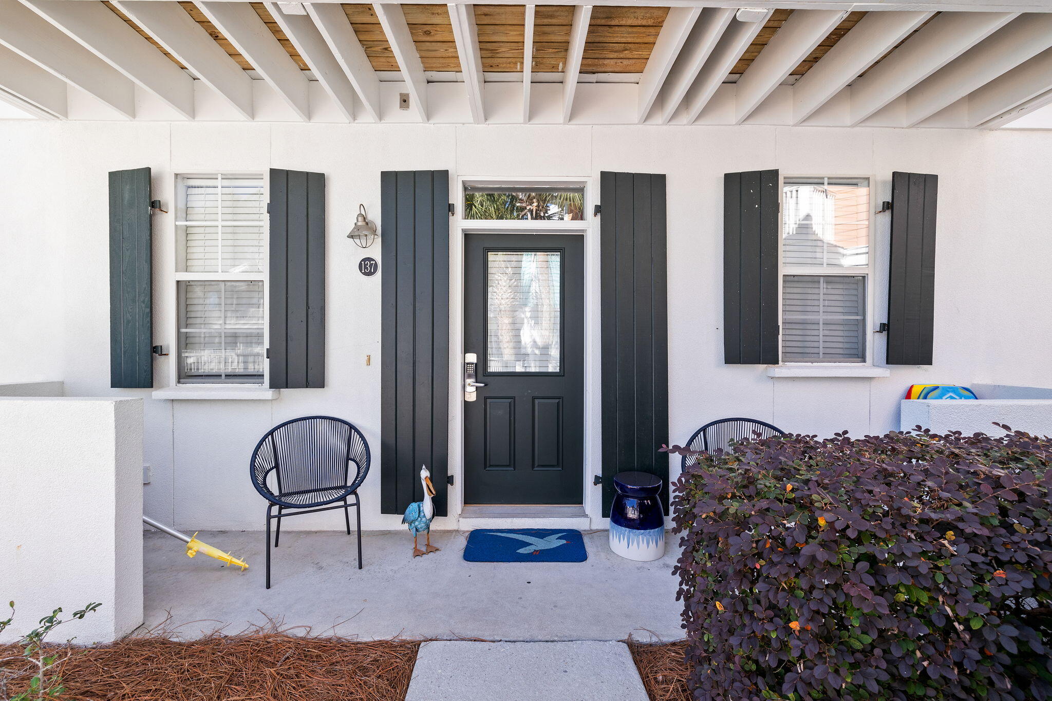 198 Somerset Bridge Road, Unit 137 Santa Rosa Beach, FL 32459 - Photo 36 of 46 a living room with furniture a window and a potted plant