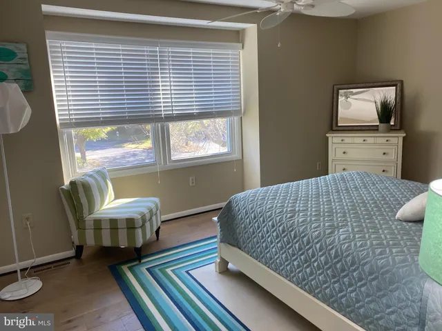 a bedroom with bed and window