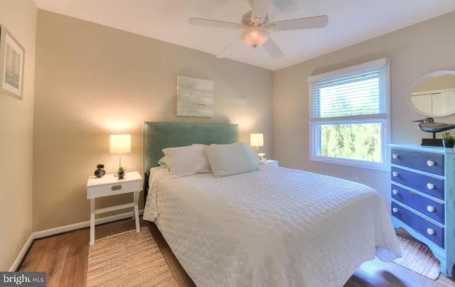 a bedroom with a bed and a dresser