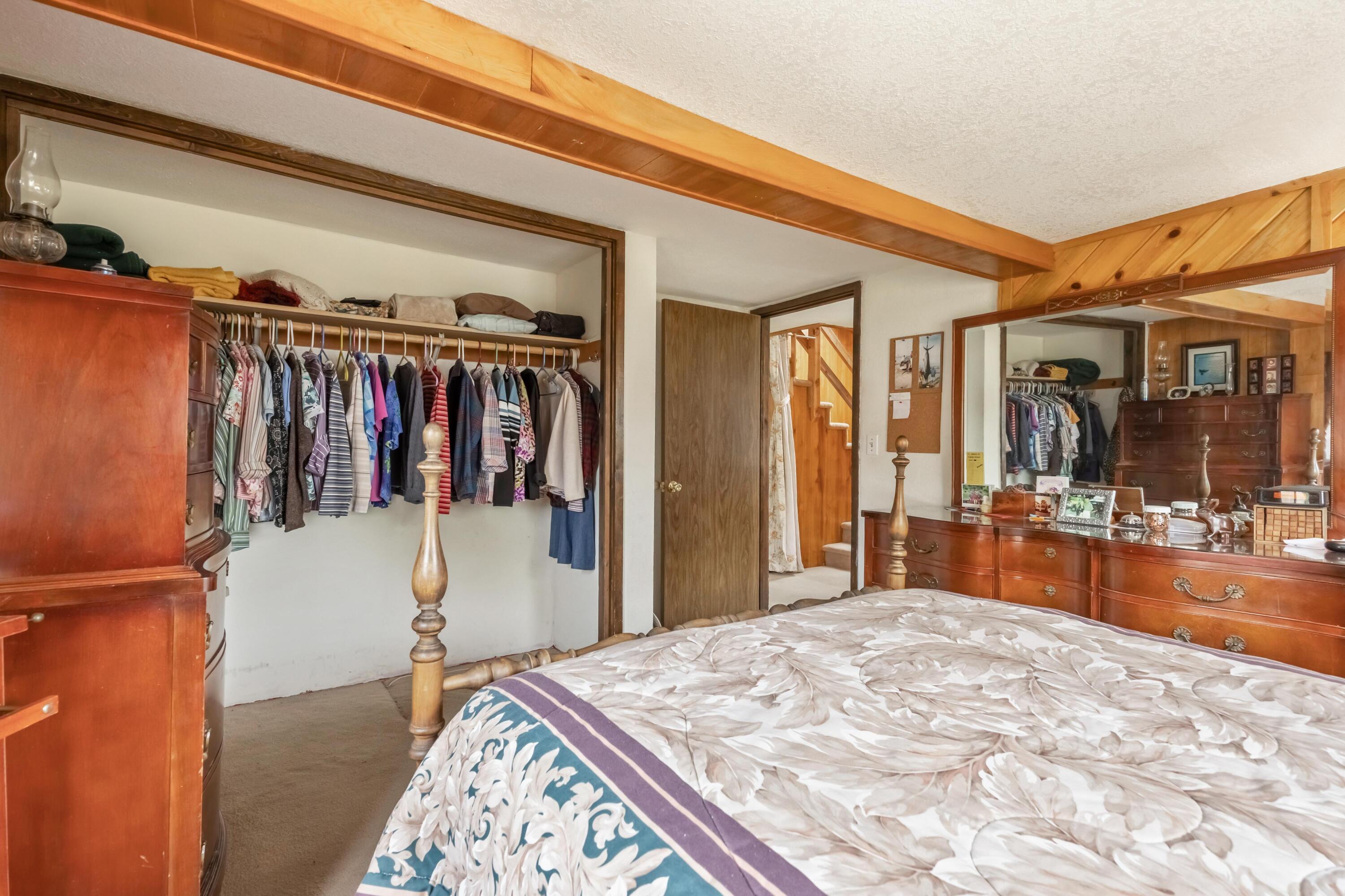 2010 Northeast Laughlin Road Prineville, OR 97754 - Photo 13 of 39 a bed room with a bed and a large mirror