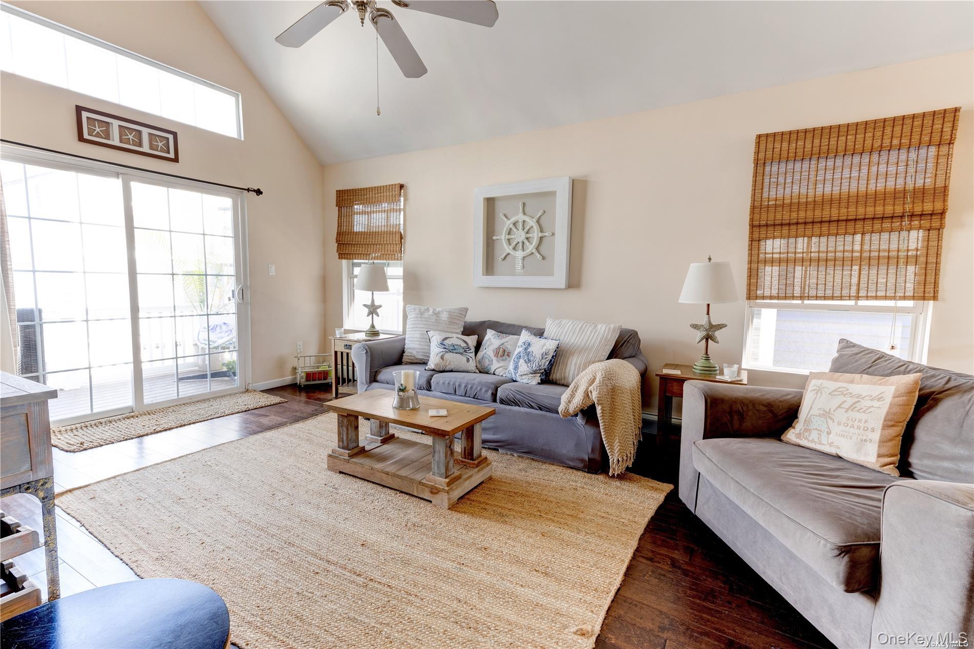 67 Vermont Street Long Beach, NY 11561 - Photo 16 of 26 a living room with furniture and a large window