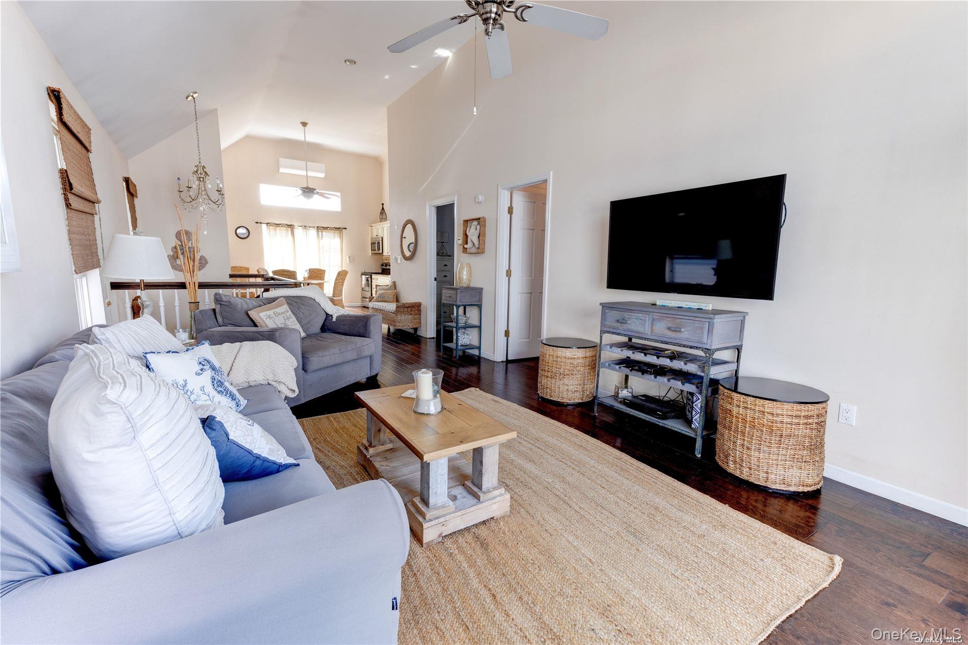 67 Vermont Street Long Beach, NY 11561 - Photo 18 of 26 a living room with furniture and a flat screen tv