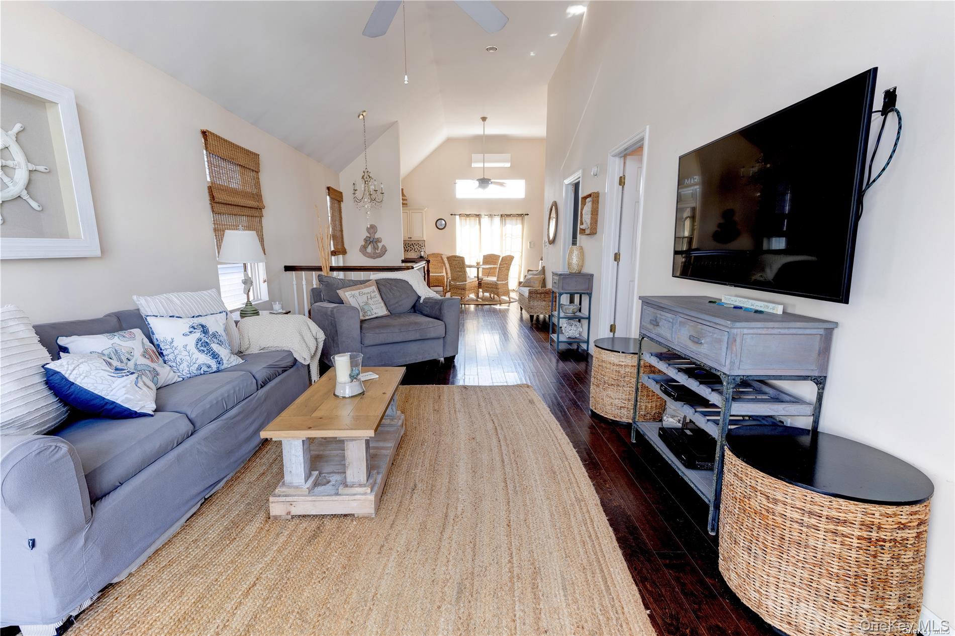 67 Vermont Street Long Beach, NY 11561 - Photo 19 of 26 a living room with furniture and a flat screen tv
