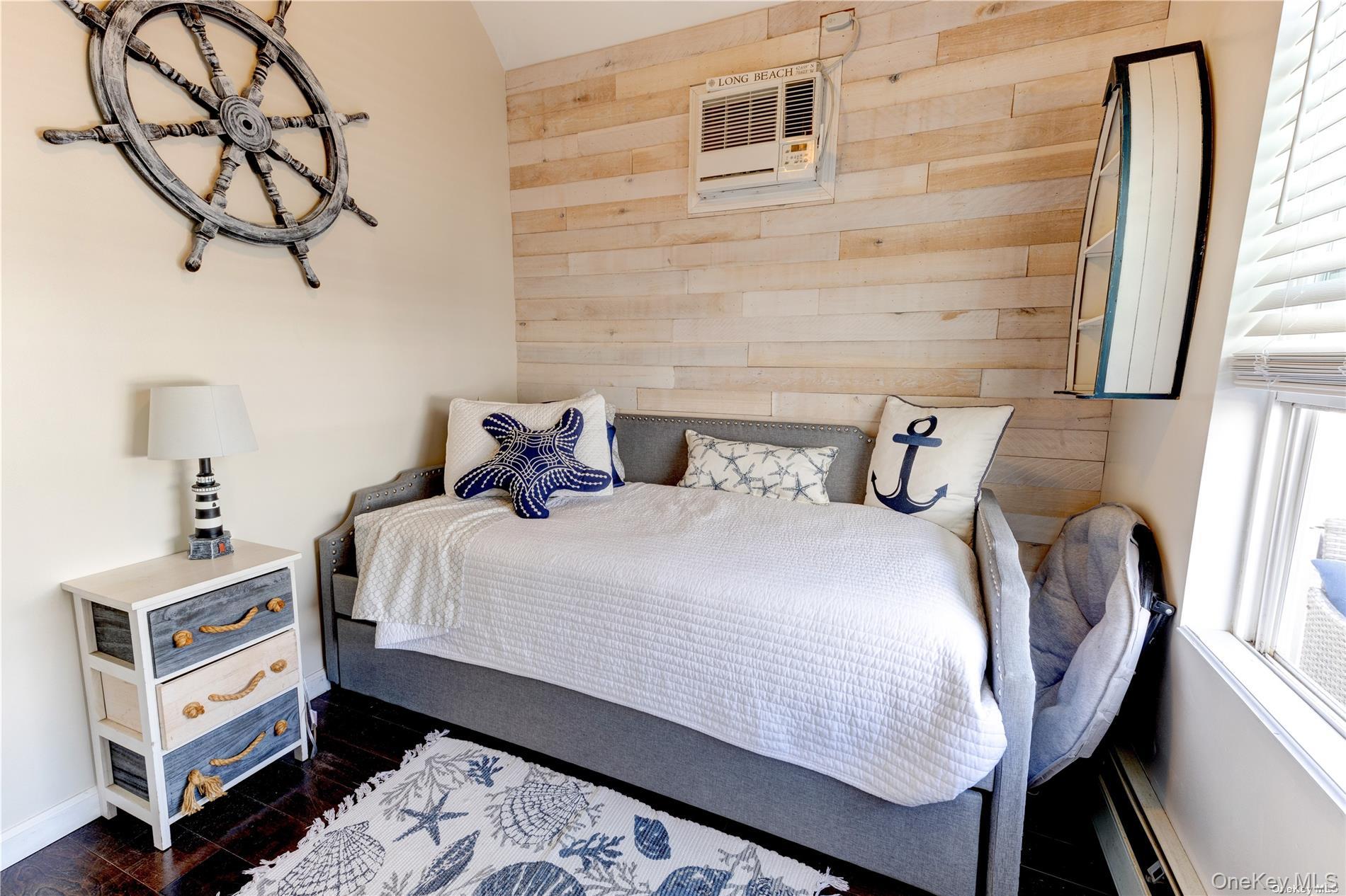 67 Vermont Street Long Beach, NY 11561 - Photo 20 of 26 a bedroom with bed and wooden floor