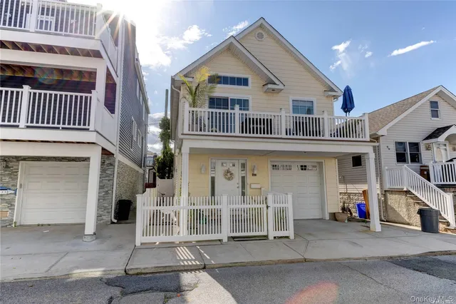a front view of a house with a garage