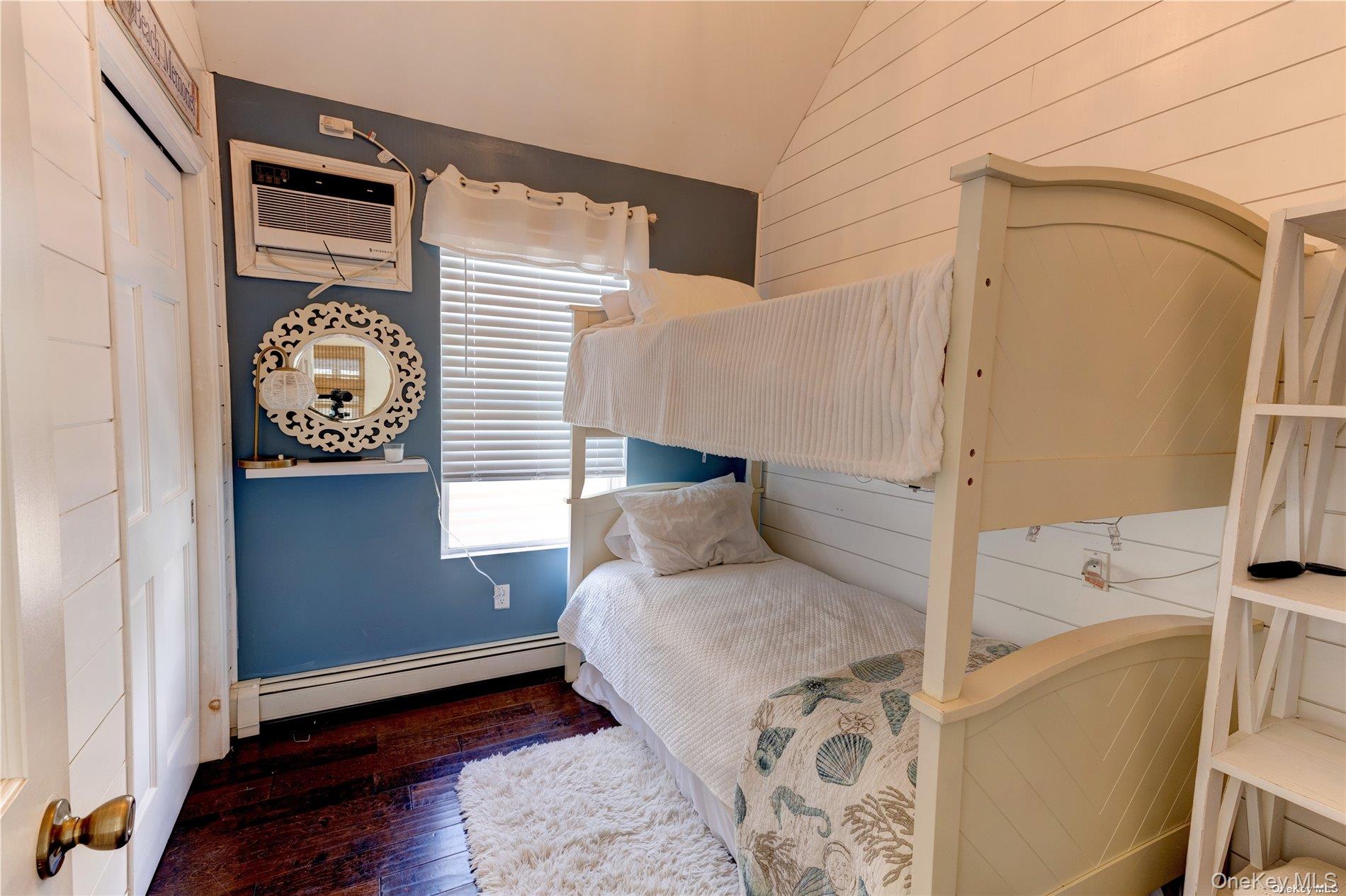 67 Vermont Street Long Beach, NY 11561 - Photo 21 of 26 a bedroom with a bed and a window