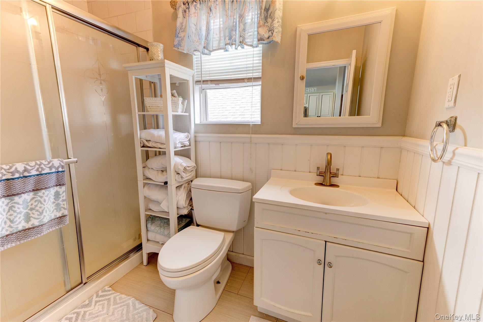 67 Vermont Street Long Beach, NY 11561 - Photo 24 of 26 a bathroom with a sink a toilet and shower