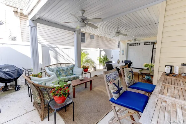 a view of a livingroom with furniture and a window
