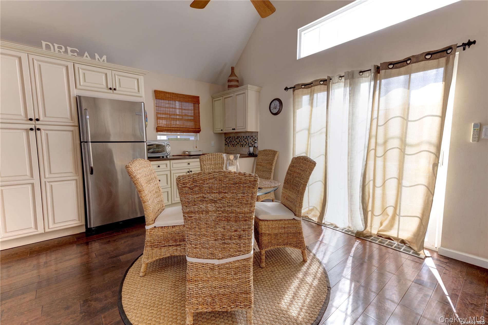 67 Vermont Street Long Beach, NY 11561 - Photo 10 of 26 a dining room with furniture and wooden floor