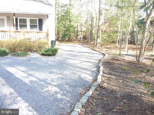 30 Beaconhill Road Ocean Pines, MD 21811 - Photo 12 of 12 front view of a house with a yard and trees