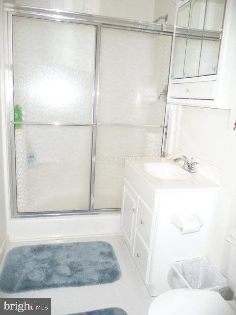 30 Beaconhill Road Ocean Pines, MD 21811 - Photo 8 of 12 a bathroom with a sink and a mirror