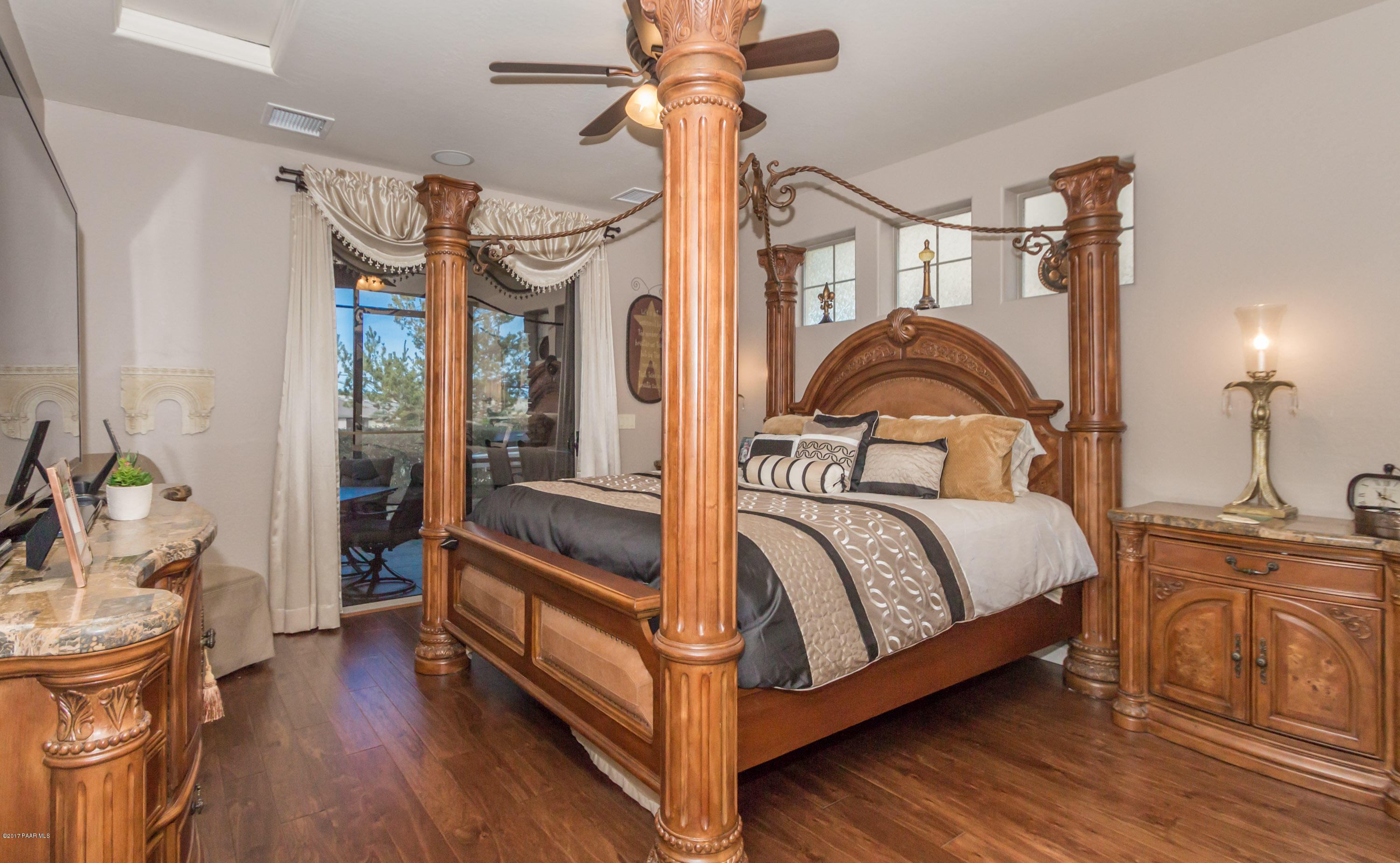 1256 Crown Ridge Drive Prescott, AZ 86301 - Photo 11 of 31 a bedroom with a bed and wooden floor