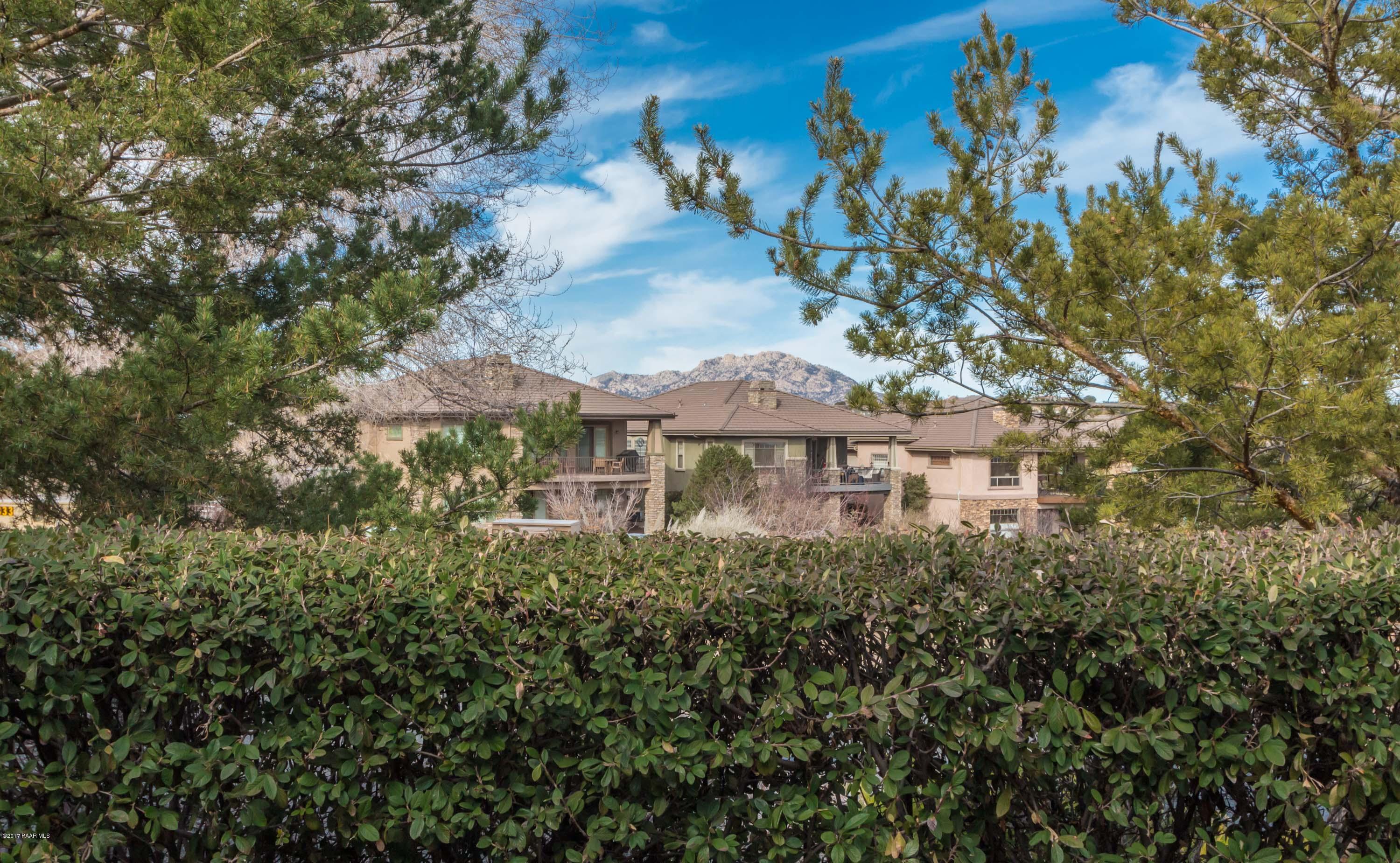 1256 Crown Ridge Drive Prescott, AZ 86301 - Photo 13 of 31 a view of a house with a tree in front of it