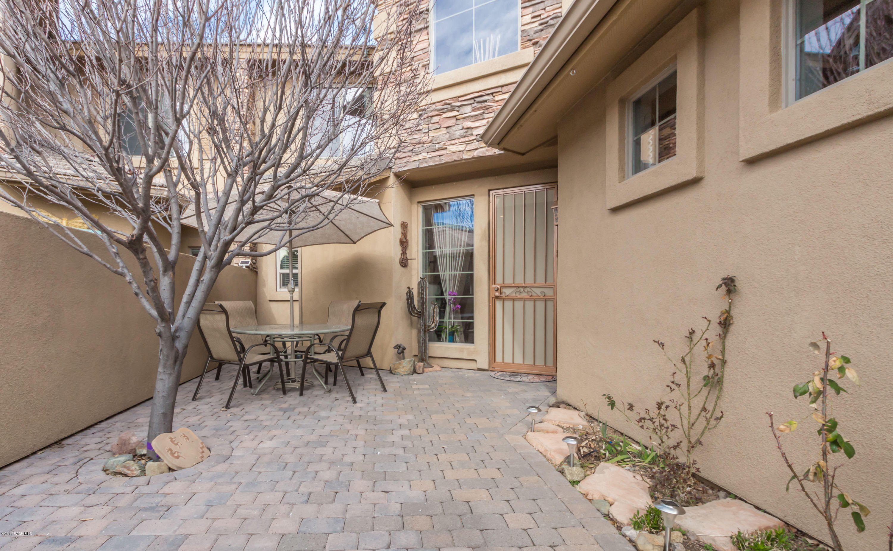 1256 Crown Ridge Drive Prescott, AZ 86301 - Photo 2 of 31 a view of a patio with table and chairs