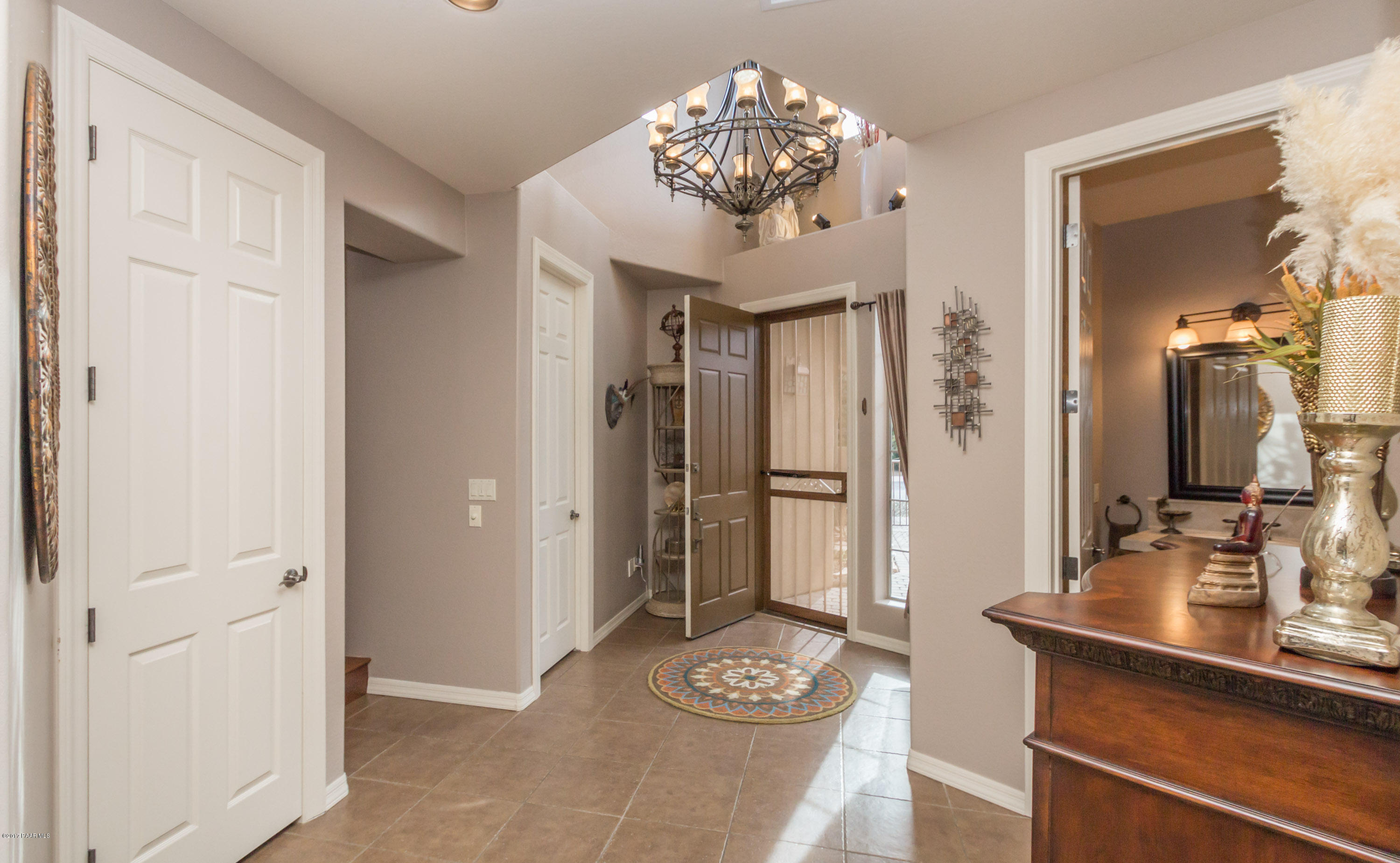 1256 Crown Ridge Drive Prescott, AZ 86301 - Photo 4 of 31 a view of a hallway with dining table and chairs