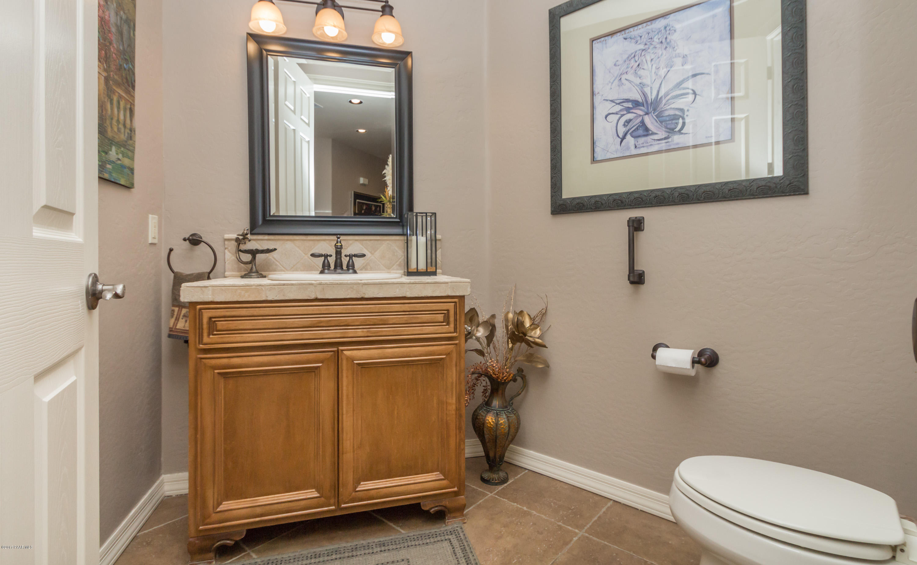 1256 Crown Ridge Drive Prescott, AZ 86301 - Photo 5 of 31 a bathroom with a toilet sink and mirror