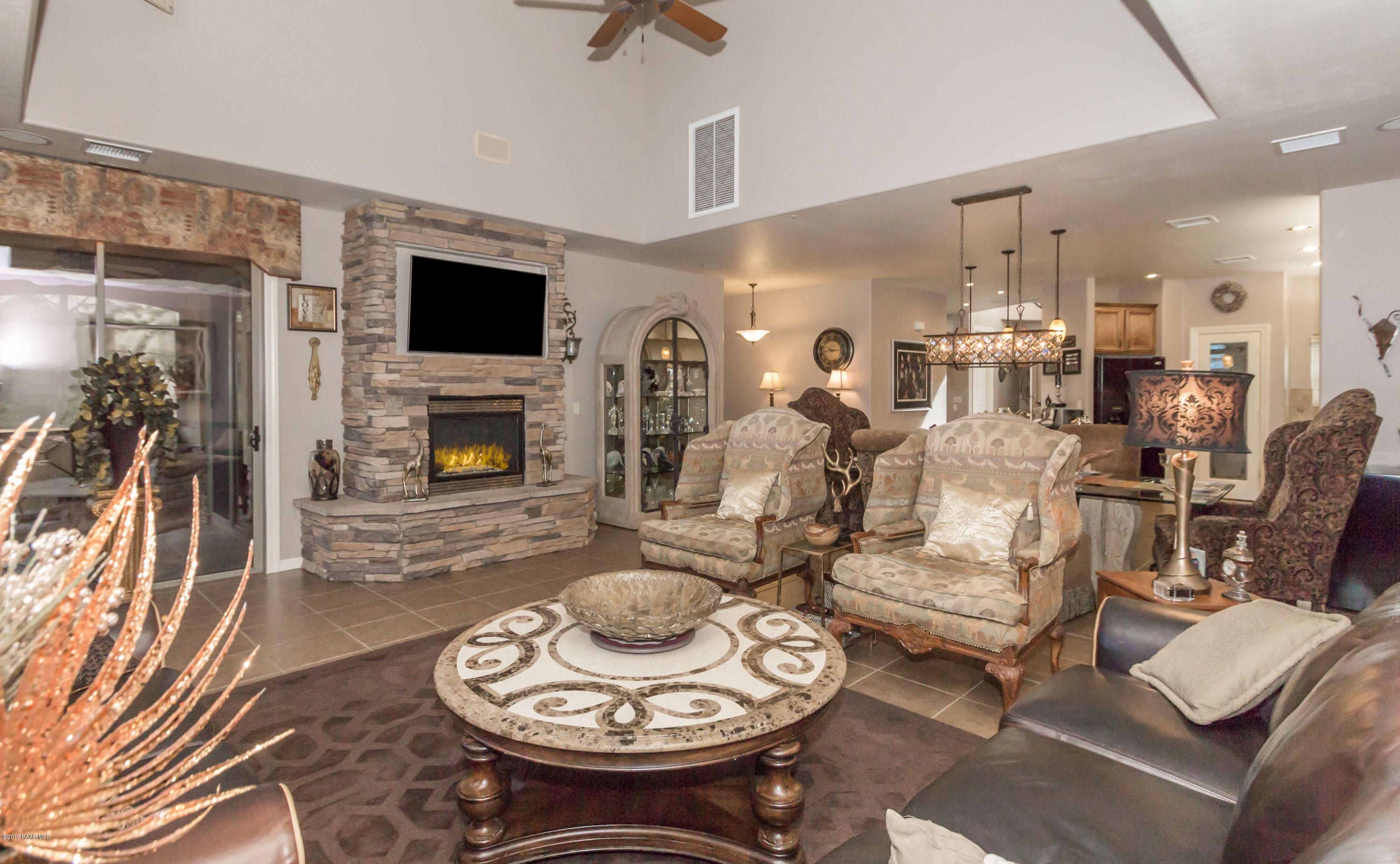 1256 Crown Ridge Drive Prescott, AZ 86301 - Photo 7 of 31 a living room with furniture and a fireplace