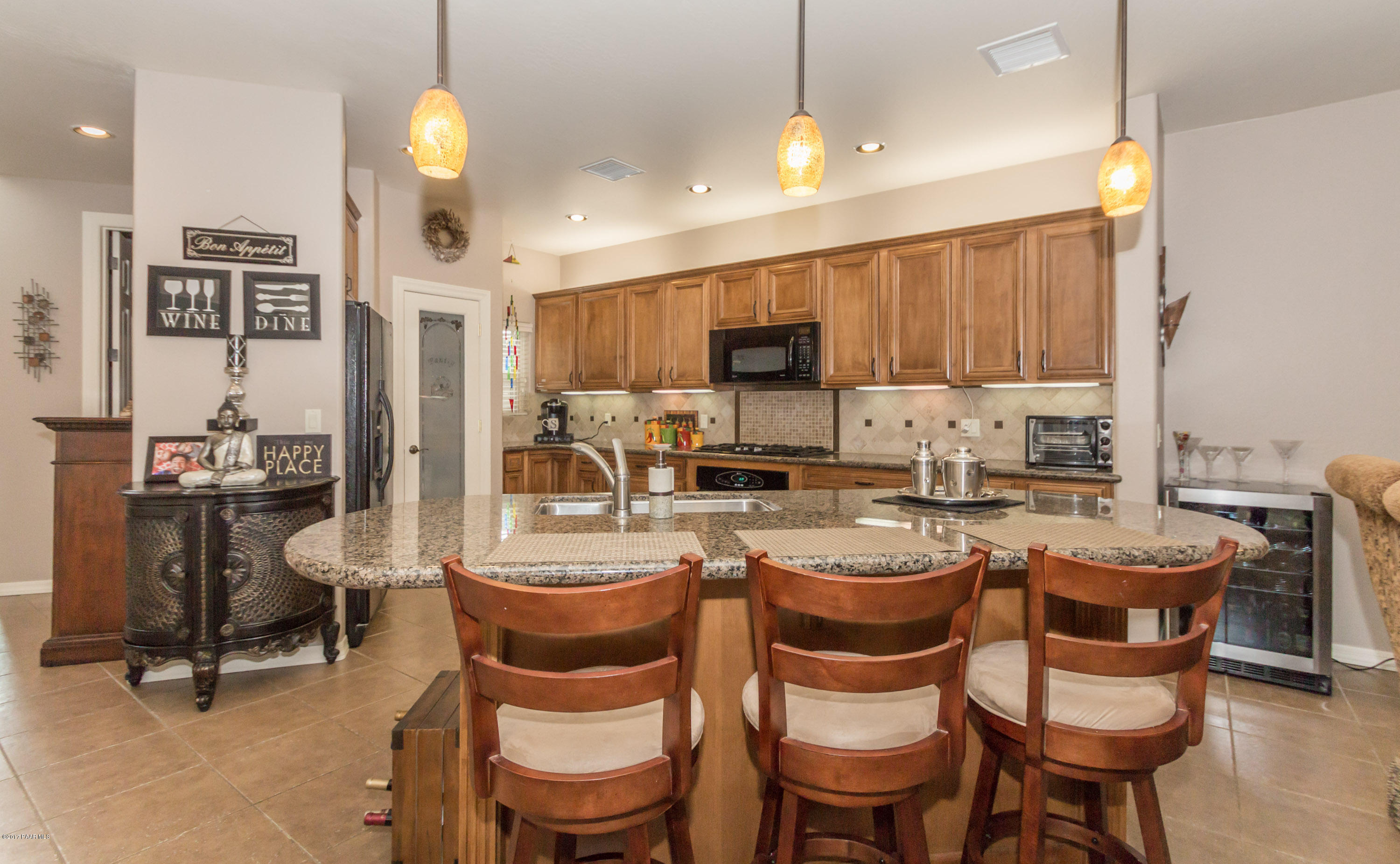 1256 Crown Ridge Drive Prescott, AZ 86301 - Photo 9 of 31 a view of a dining room with furniture
