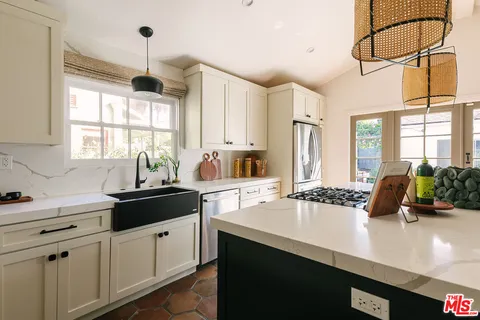 a bathroom with a sink a mirror and shower
