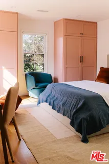 a living room with furniture a rug and a table