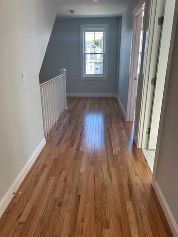 a view of entryway with wooden floor