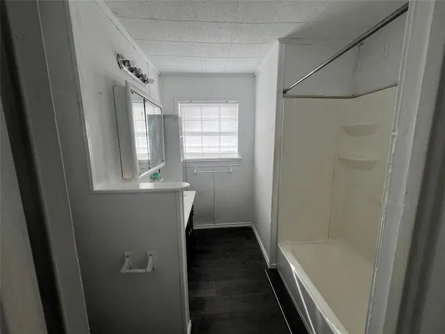 a view of empty room with windows